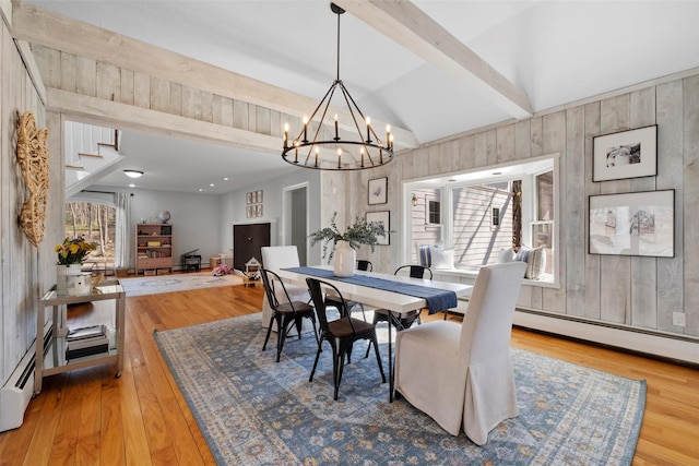 dining area with stairs, wood finished floors, and a wealth of natural light