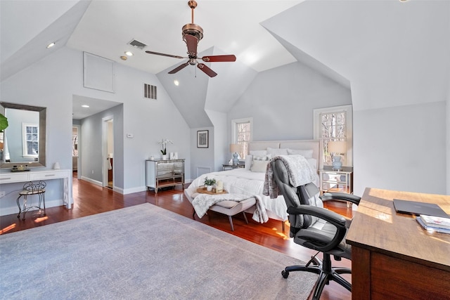 bedroom featuring high vaulted ceiling, visible vents, baseboards, and wood finished floors