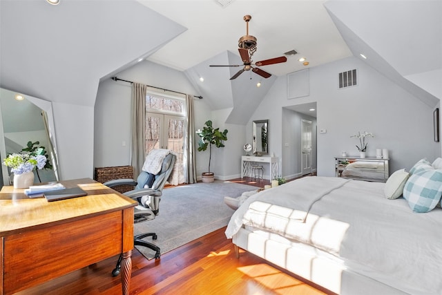 bedroom with vaulted ceiling, wood finished floors, visible vents, and recessed lighting