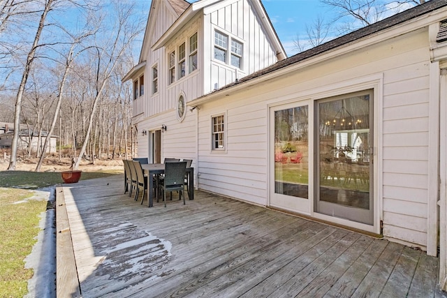 wooden deck featuring outdoor dining area