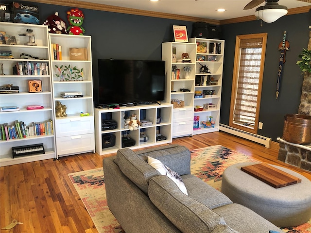 living room with recessed lighting, a baseboard radiator, wood finished floors, and crown molding