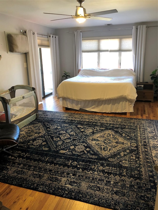 bedroom featuring ceiling fan and wood finished floors