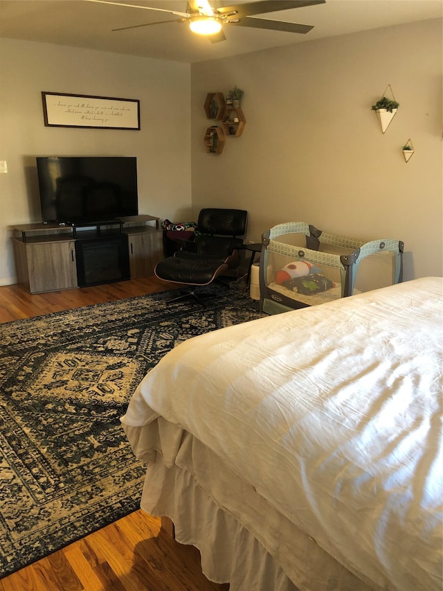 bedroom featuring ceiling fan and wood finished floors