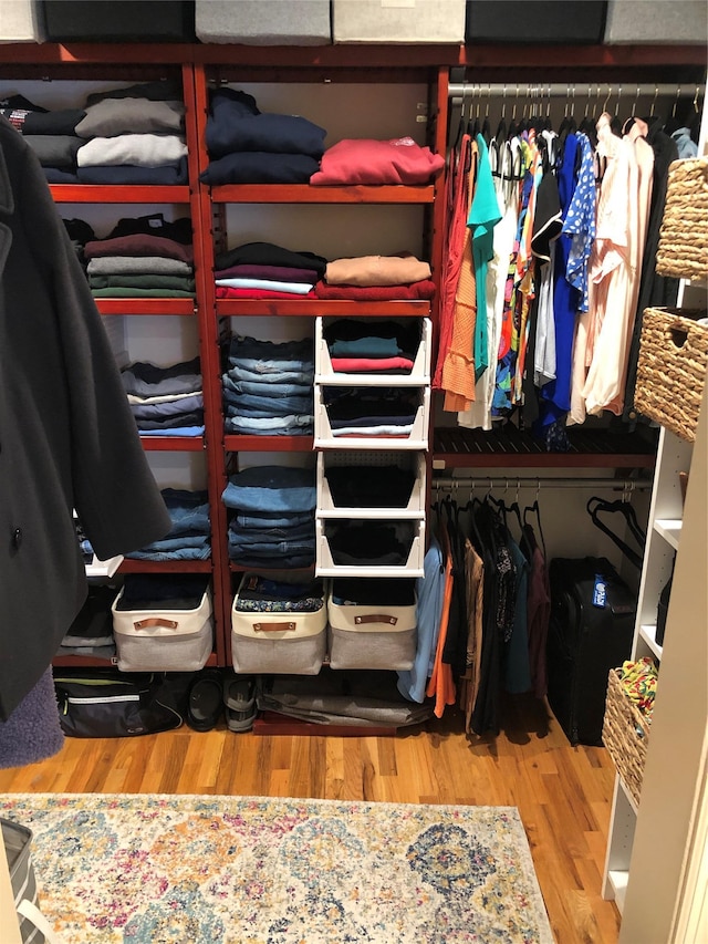 spacious closet with wood finished floors