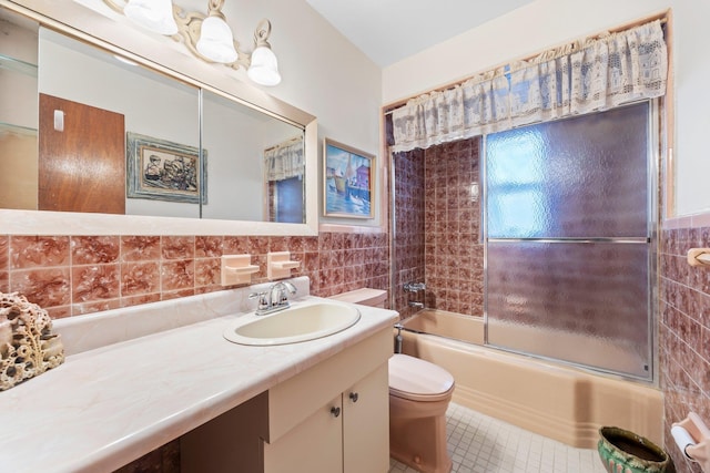 15744 97th St, Howard Beach, NY 11414 - bathroom with toilet, shower / bath combination with glass door, tile walls, and vanity