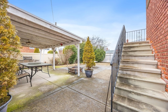 15744 97th St, Howard Beach, NY 11414 - view of patio with outdoor dining area, fence, and stairway