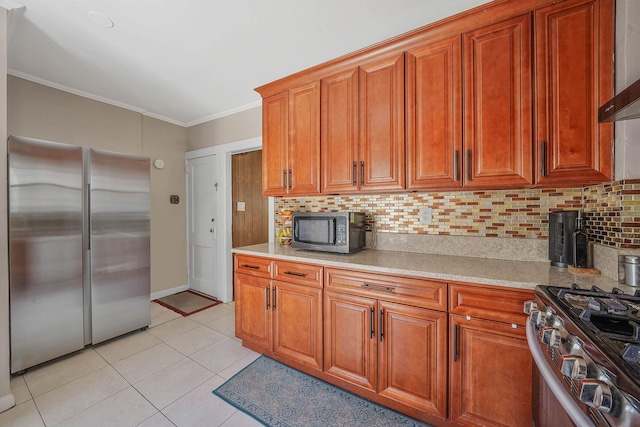 kitchen with stainless steel appliances, ornamental molding, backsplash, and light countertops