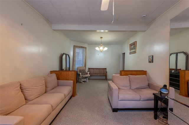 carpeted living area with a chandelier, baseboards, and ornamental molding