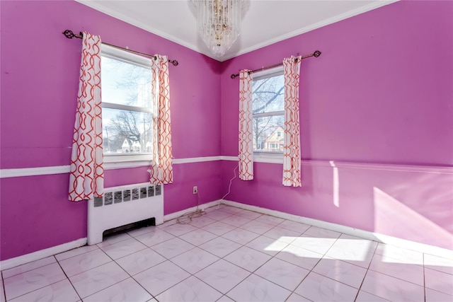 tiled empty room with baseboards, ornamental molding, radiator heating unit, and an inviting chandelier