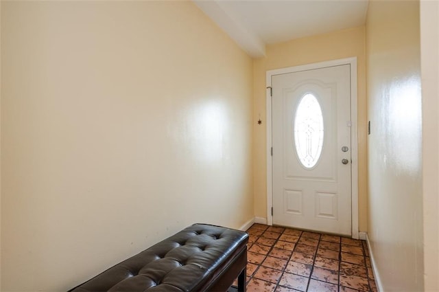 entryway featuring baseboards