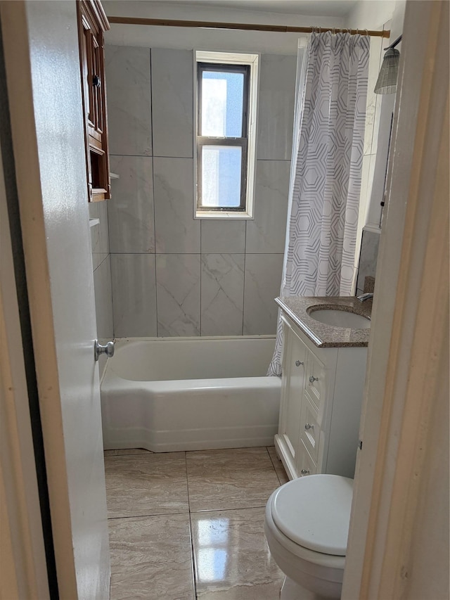 bathroom with shower / bath combo, vanity, and toilet