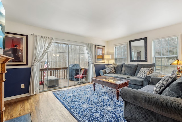 living room featuring baseboards and wood finished floors