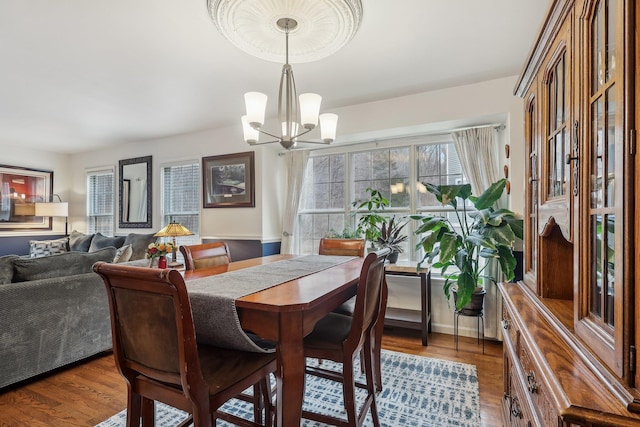 dining room featuring an inviting chandelier and wood finished floors