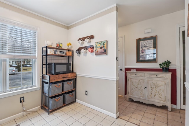 dining space with light tile patterned floors and baseboards