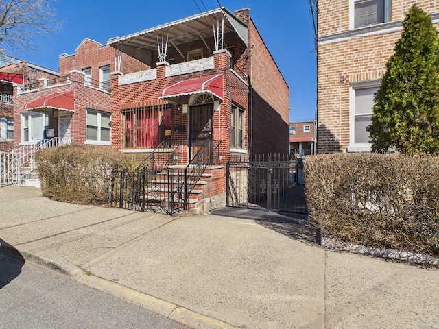 view of front of home featuring brick siding