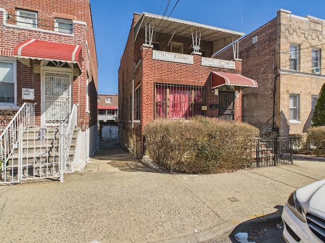 view of front of property featuring brick siding