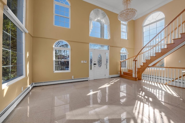 entryway with stairs, a baseboard radiator, and crown molding