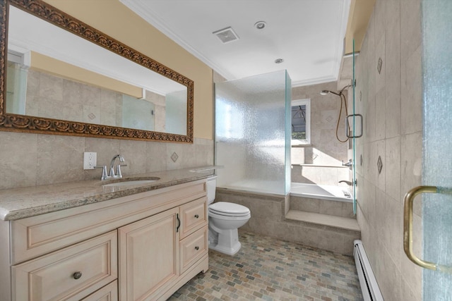 full bath with a baseboard radiator, crown molding, a tile shower, and tile walls