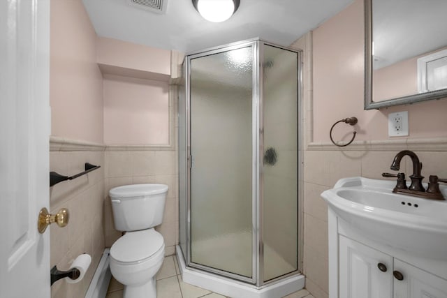 full bath featuring tile walls, visible vents, a stall shower, vanity, and tile patterned flooring