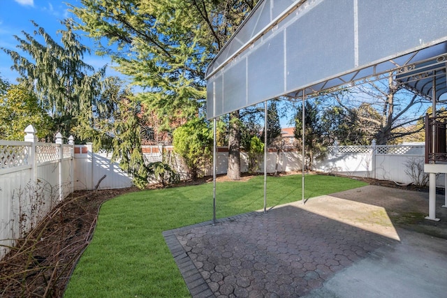 view of yard featuring a patio area and a fenced backyard