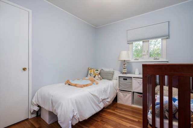 bedroom featuring wood finished floors