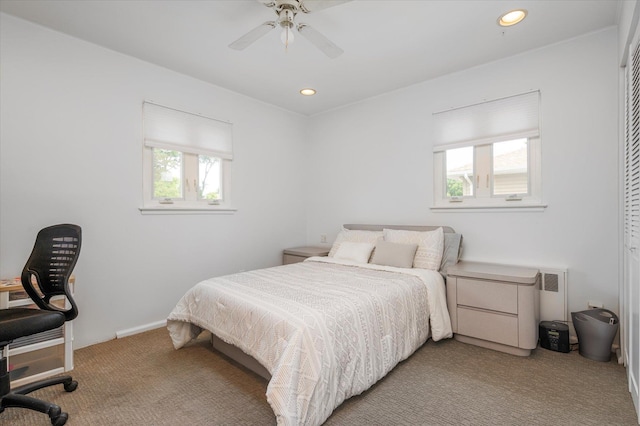 bedroom featuring light carpet, ceiling fan, and recessed lighting