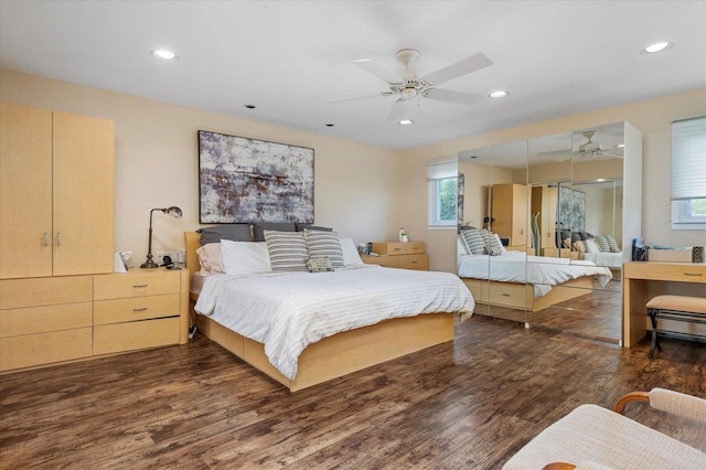 bedroom with dark wood-type flooring, recessed lighting, and a ceiling fan