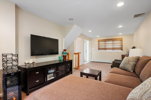 living area with baseboard heating, carpet flooring, visible vents, and recessed lighting