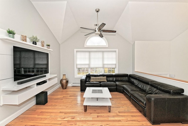 living area with baseboards, a ceiling fan, lofted ceiling, a baseboard radiator, and light wood-type flooring