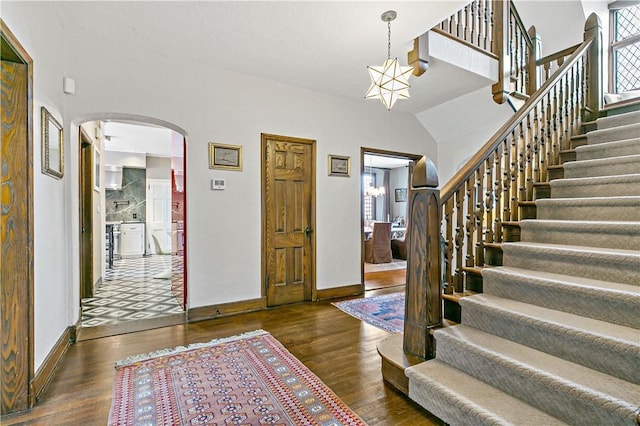 31 Old Army Rd, Scarsdale, NY 10583 - entrance foyer featuring arched walkways, baseboards, and wood finished floors
