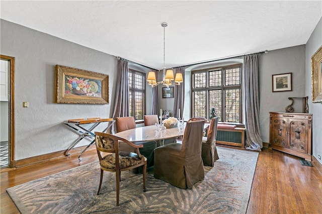 31 Old Army Rd, Scarsdale, NY 10583 - dining area with baseboards, a chandelier, and wood finished floors