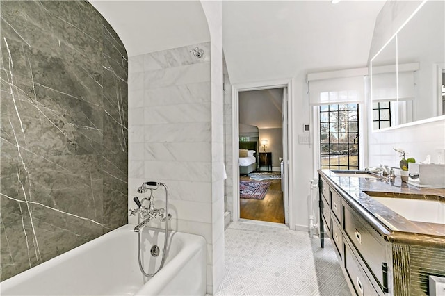 31 Old Army Rd, Scarsdale, NY 10583 - full bathroom with ensuite bathroom, a sink, a tub to relax in, double vanity, and tile patterned floors