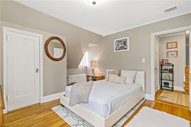 31 Old Army Rd, Scarsdale, NY 10583 - bedroom featuring wood finished floors, radiator heating unit, baseboards, and visible vents