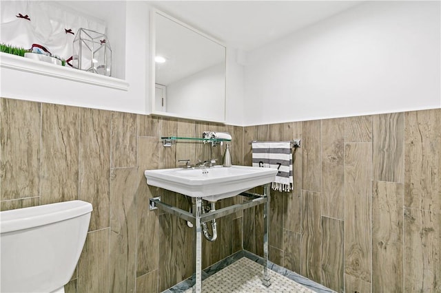 31 Old Army Rd, Scarsdale, NY 10583 - bathroom with a wainscoted wall, tile walls, and toilet