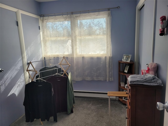 carpeted bedroom featuring a baseboard radiator