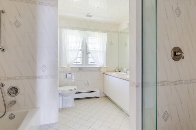 bathroom featuring visible vents, bathing tub / shower combination, toilet, a baseboard heating unit, and tile walls