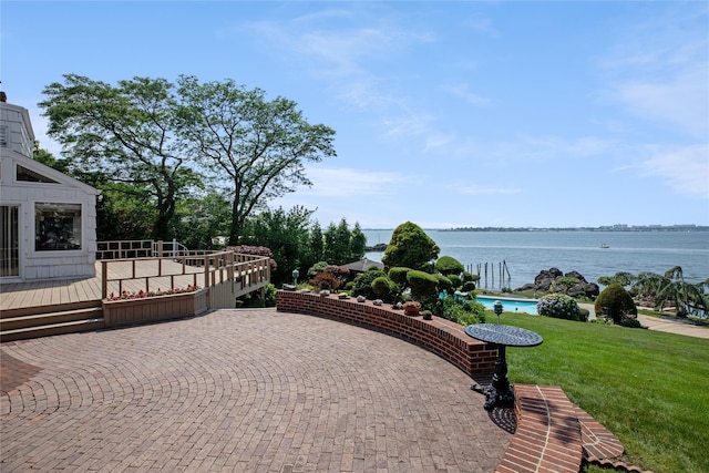 view of patio with a deck with water view