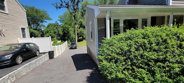 view of side of home with fence