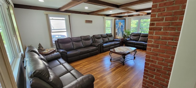 living area featuring beamed ceiling, light wood-type flooring, coffered ceiling, and recessed lighting