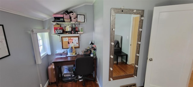 home office with ornamental molding, visible vents, and wood finished floors