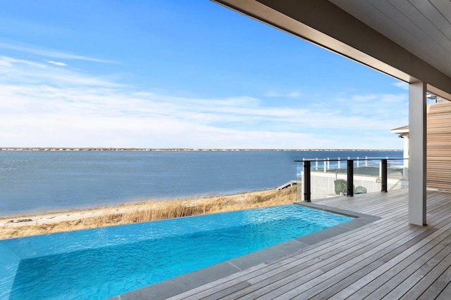 exterior space with a water view and a balcony