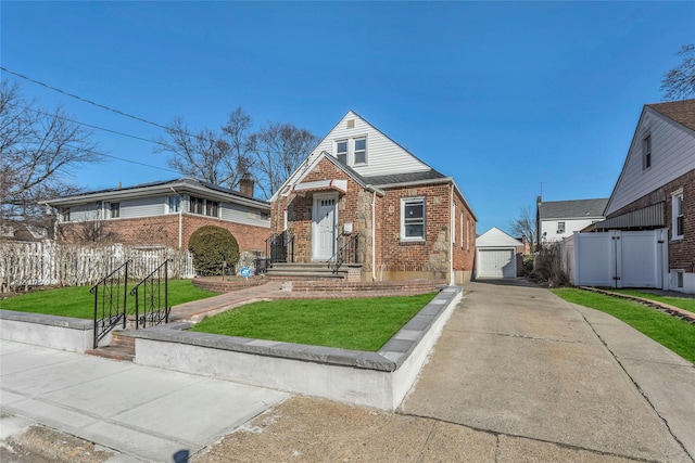 bungalow-style house with brick siding, a front lawn, fence, an outbuilding, and a gate