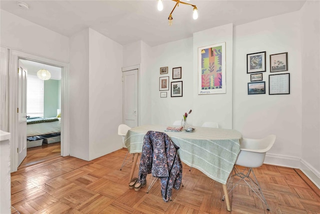 dining area featuring baseboards