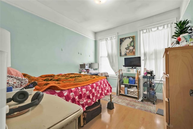 bedroom with wood finished floors