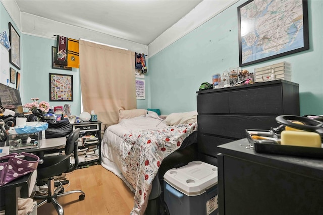 bedroom featuring wood finished floors