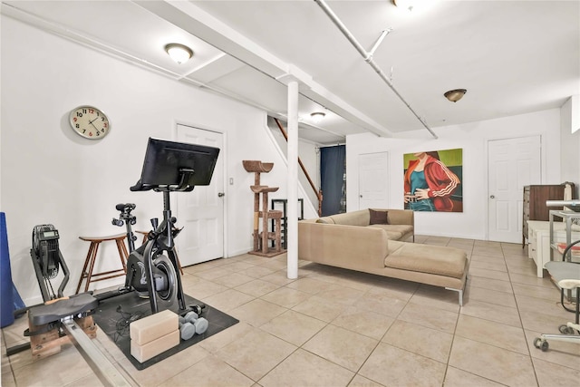 workout area featuring light tile patterned floors