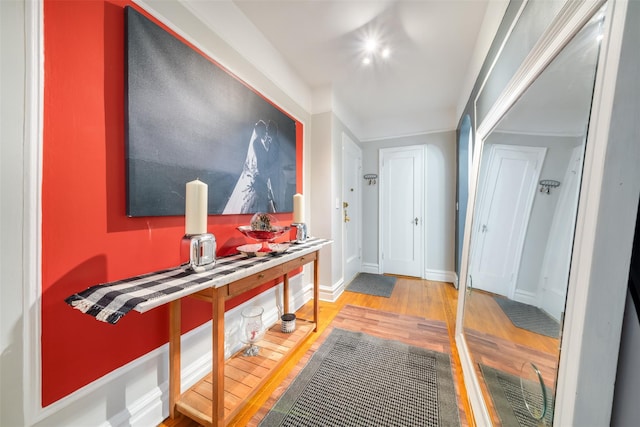 interior space with baseboards and wood finished floors