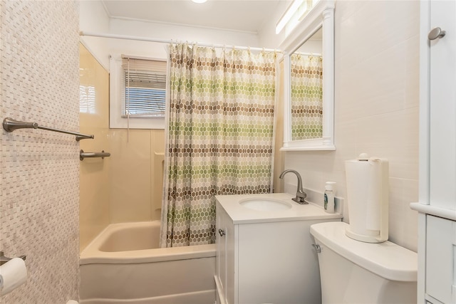 full bathroom featuring shower / tub combo, vanity, and toilet