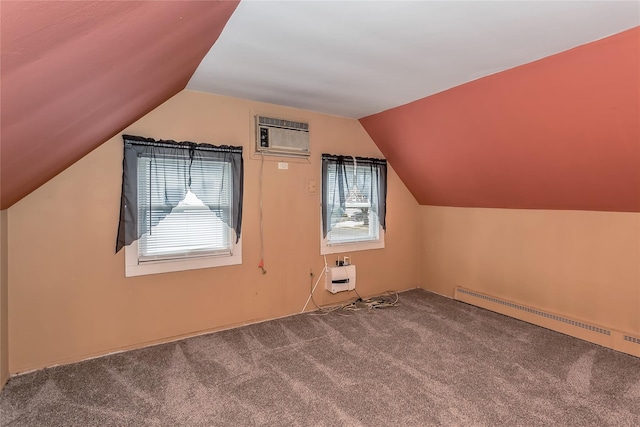 additional living space with carpet floors, a baseboard radiator, a wall unit AC, and lofted ceiling