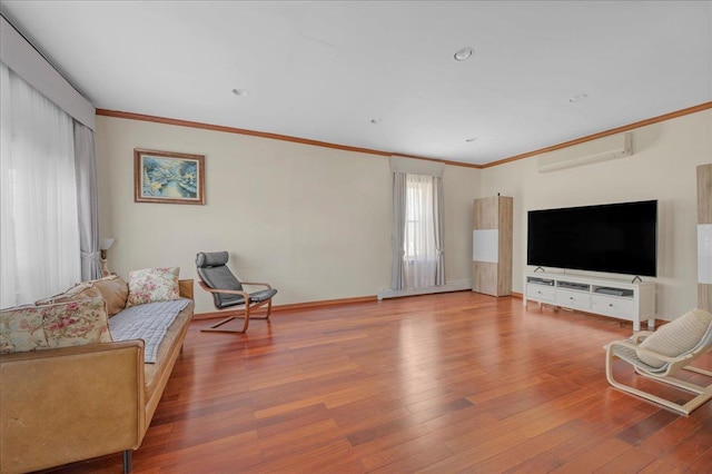 living room featuring hardwood / wood-style flooring, ornamental molding, and a wall mounted AC